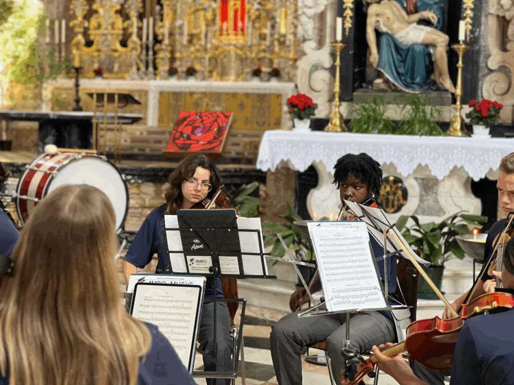 Students from American Music Abroad performing in a European cathedral