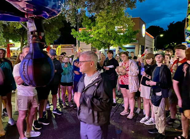 A person standing in the middle of a crowd.