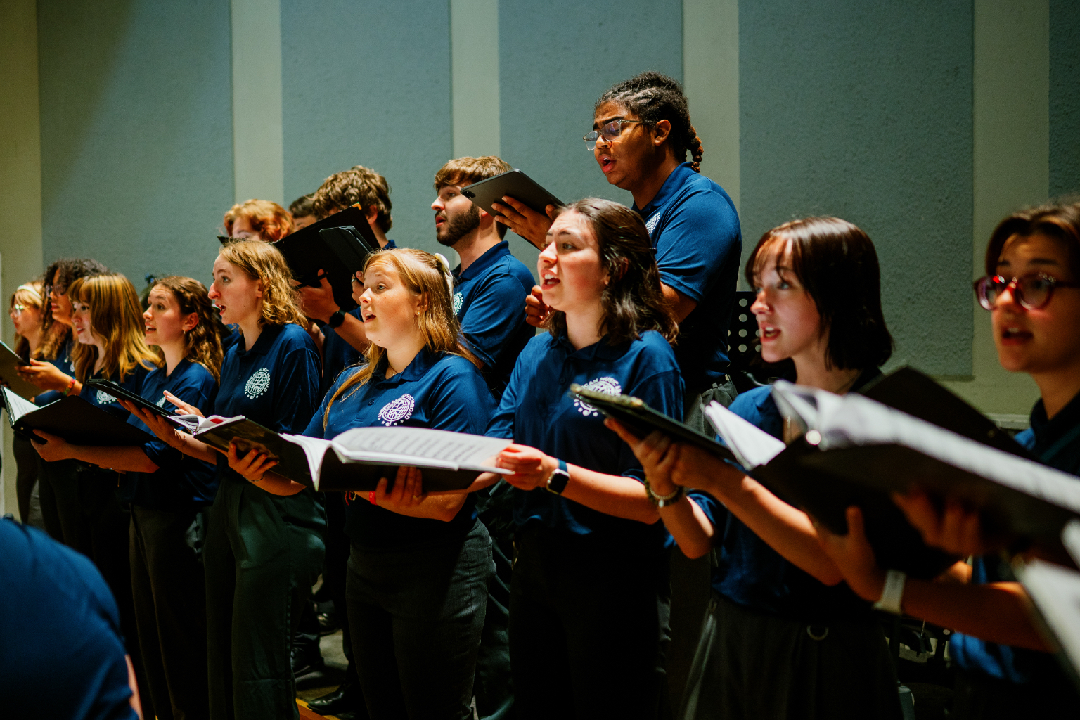 Choir members performing together during the AMA Collegiate Tour.