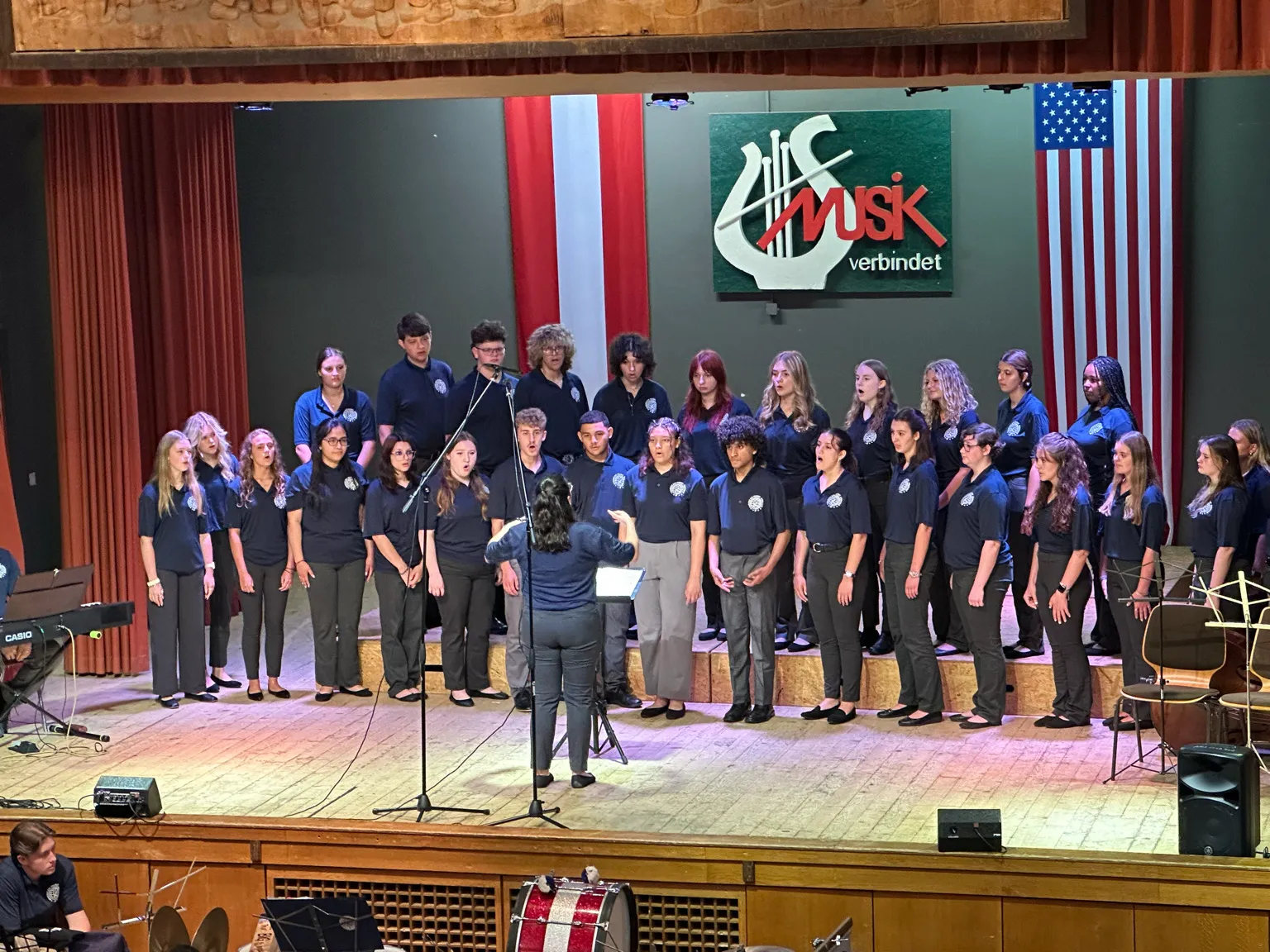 AMA Gold Tour choir performing on stage in Austria during their first concert.