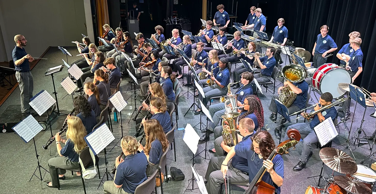 High school musicians performing together during the AMA Gold Tour 2025.