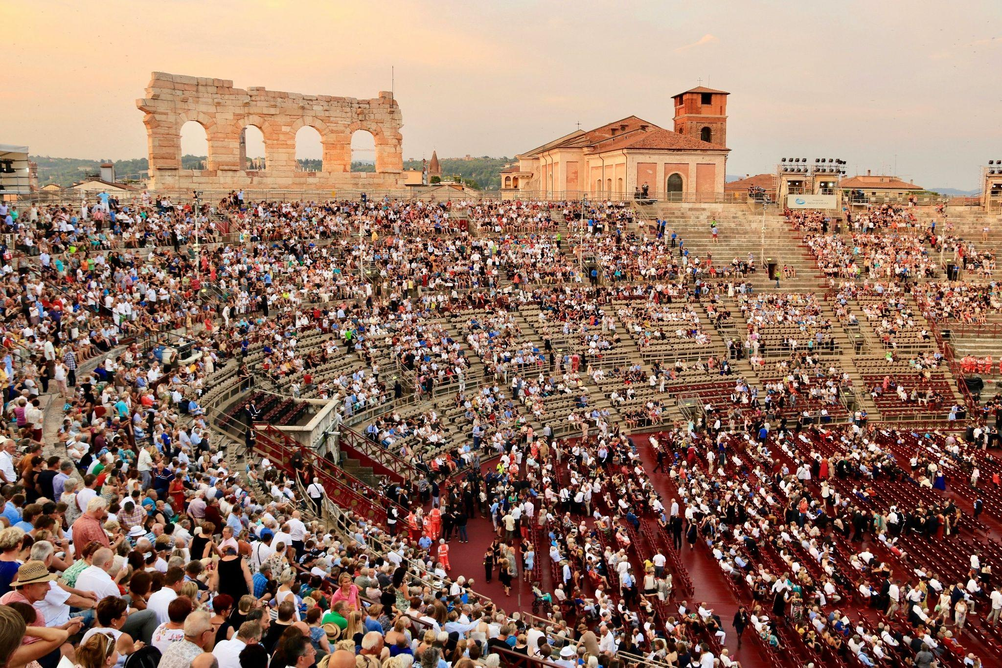 Audience gathering inside the Arena di Verona.