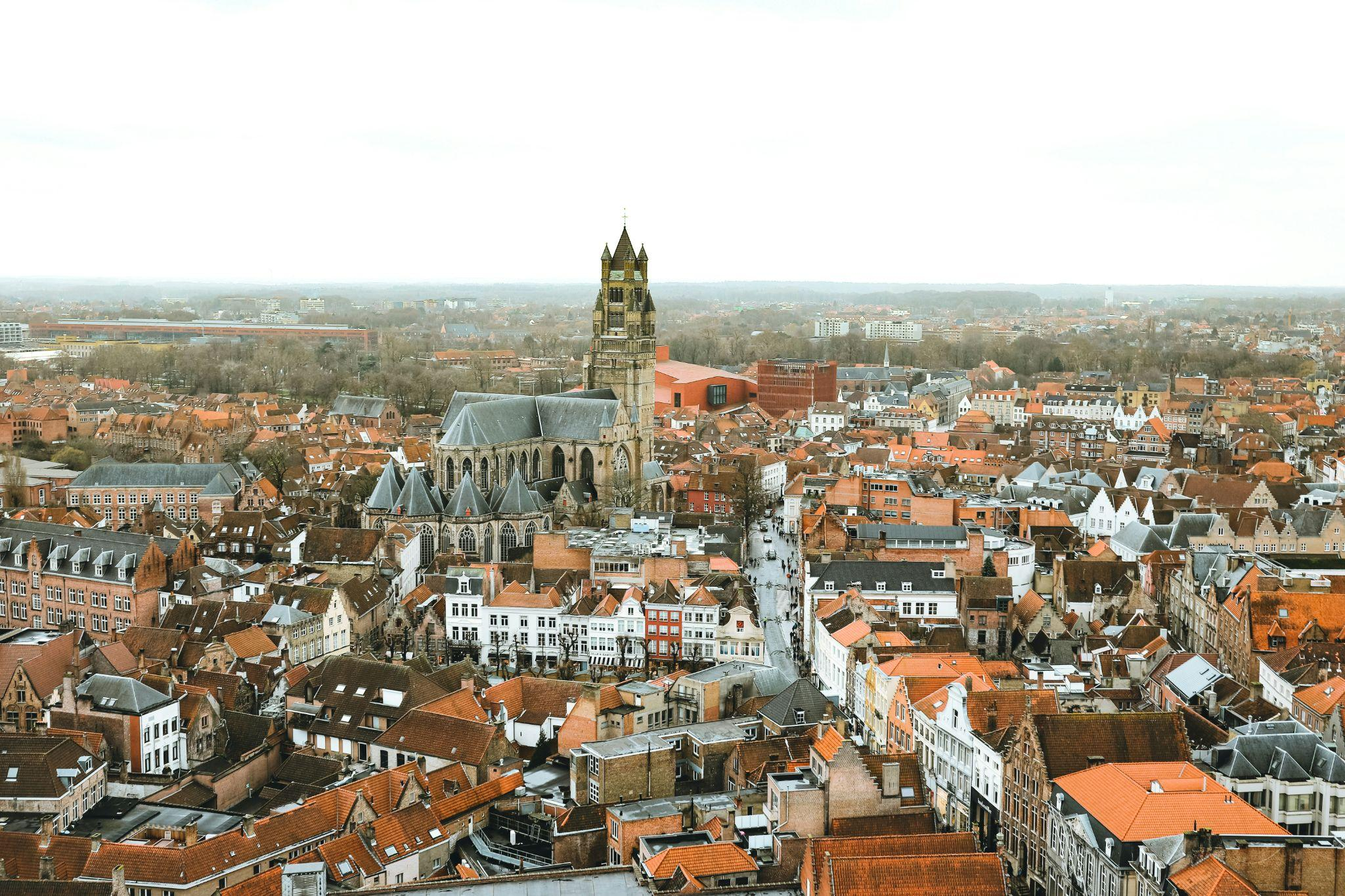 Aerial view of Brugge’s historic towers and canals in Belgium.