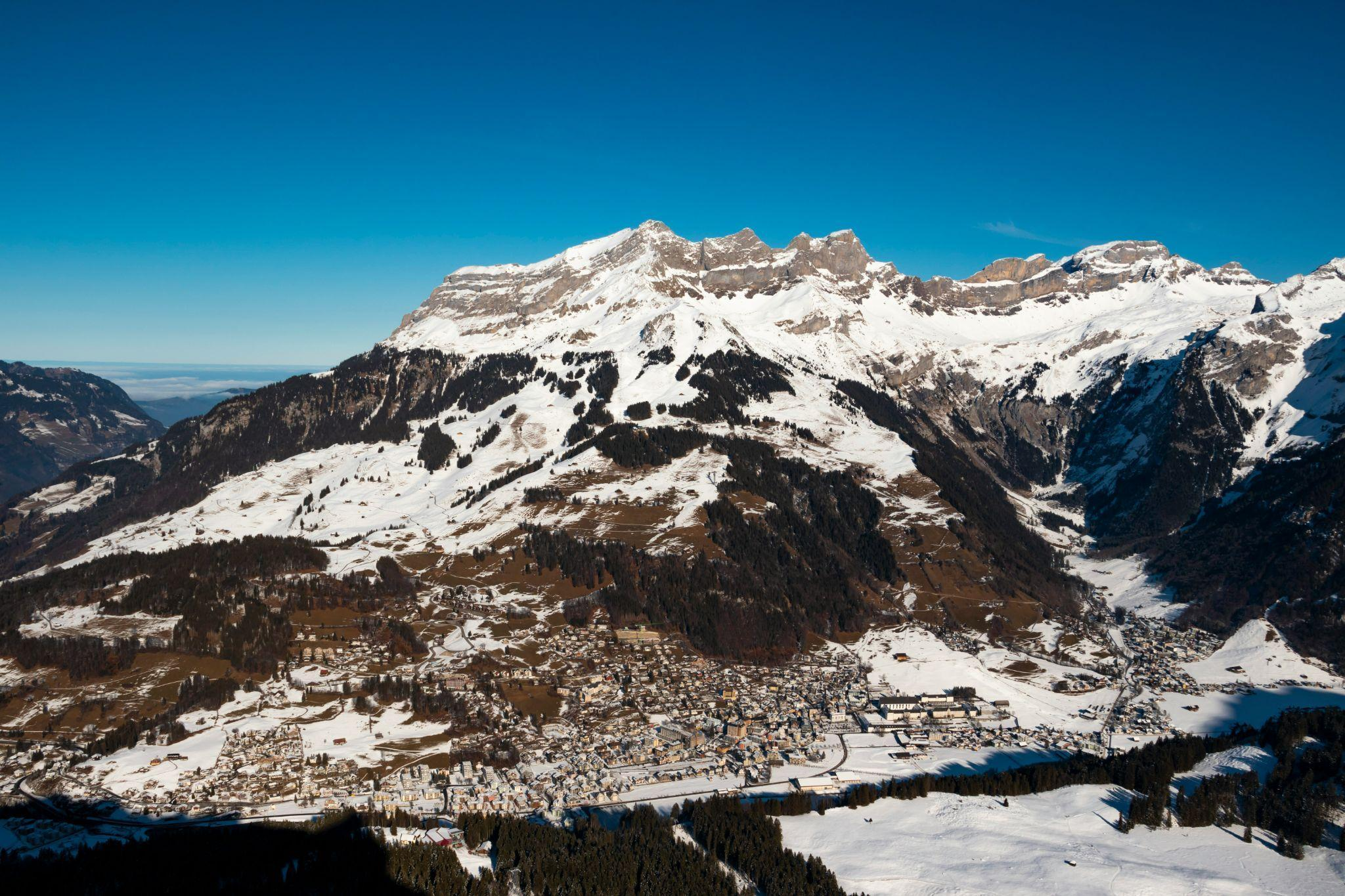 Snow-covered Engelberg village and mountains in Switzerland.