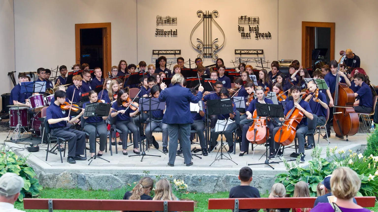 Student orchestra performing outdoors in Austria.