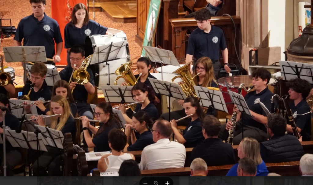 College musicians performing in a hall
