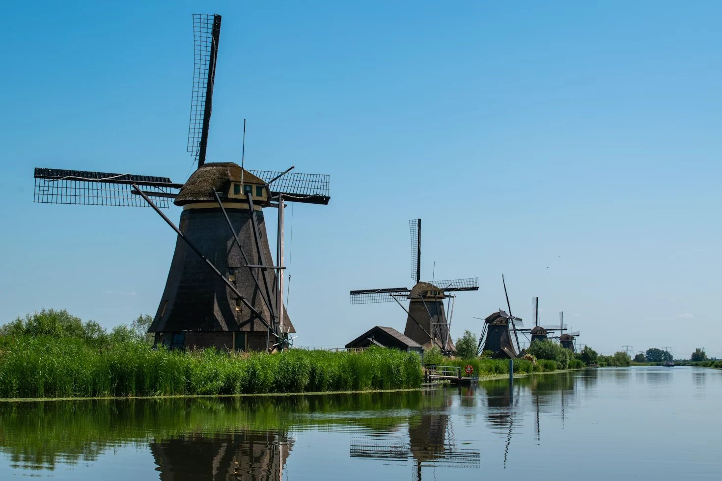 Historic windmills along the river in Kinderdijk, Netherlands.