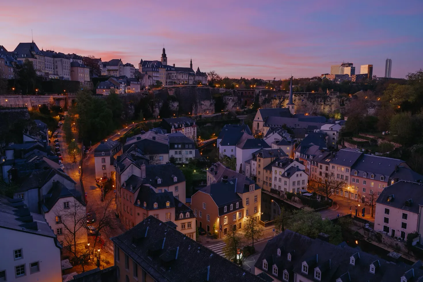 Aerial view of Luxembourg City showing a mix of historic buildings and modern architecture.