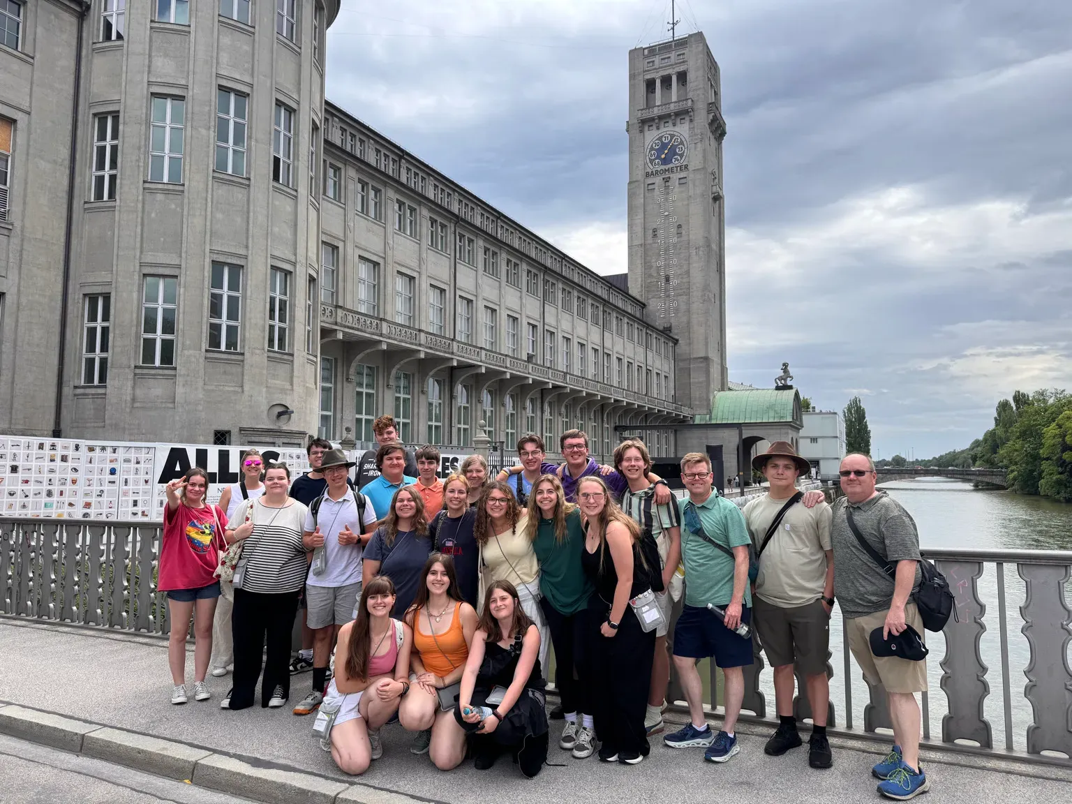 Group of students on a bridge in Munich, Germany, near the Isar River.
