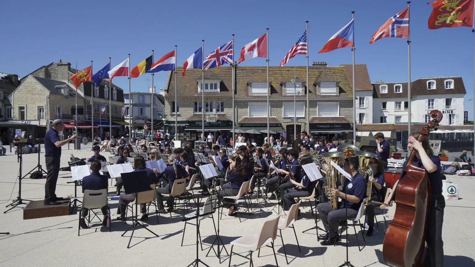 Student musicians performing together in a public square.