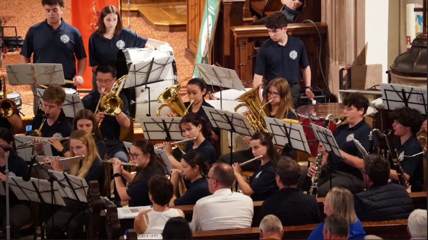 Student performers showcase their talent during a memorable international concert experience.