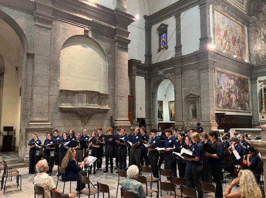 Student choir performing inside a historic cathedral during an American Music Abroad music performance tour.